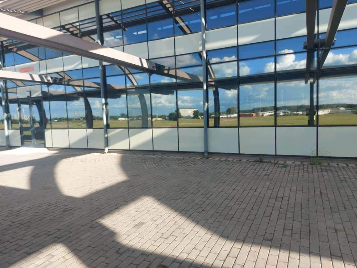 Nanoshade Silver 20 reflective film applied to curved office park facade for daytime privacy and heat rejection